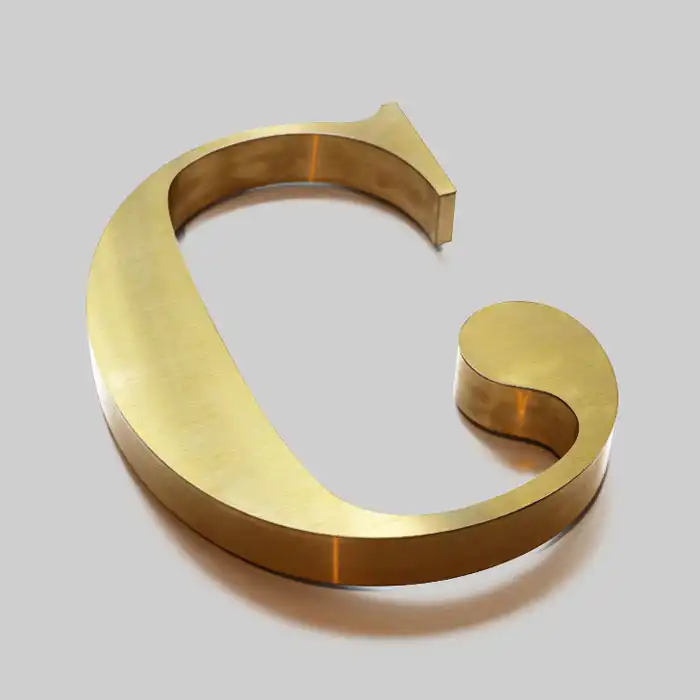 letras-en-3d-en-aluminio-dorado-cepillado-1 letras en 3d en aluminio dorado cepillado 1